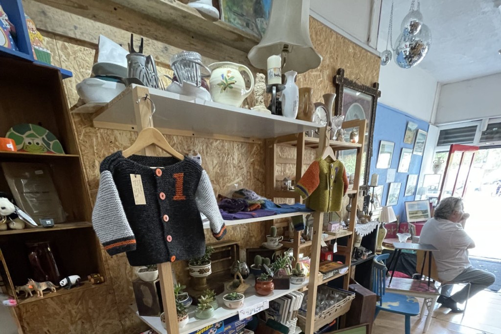 Forestgate shop interior with bric-a0brac and clothing on display. Newham, London