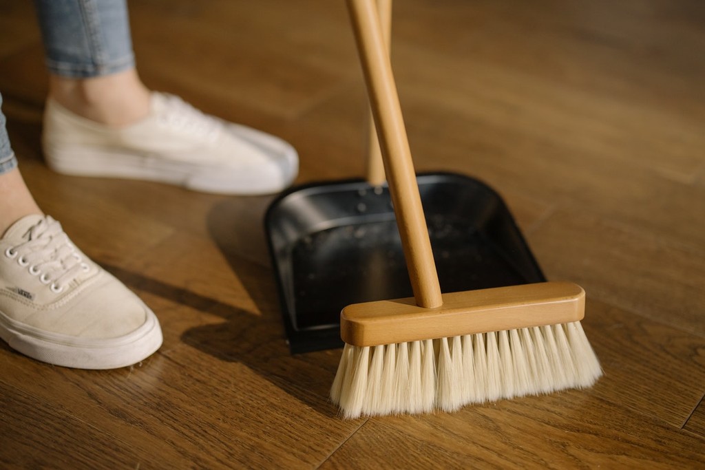 person cleaning their house for a viewing