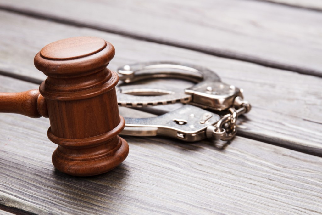 Close-up gavel and handcuffs representing buy to let unshackled