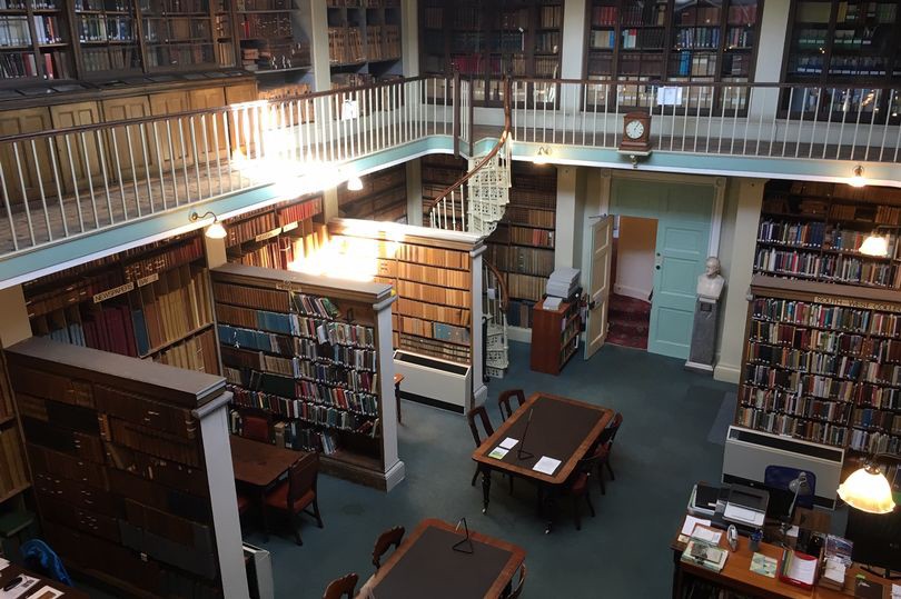 Devon &amp; Exeter Institution, lots of old book shelves.