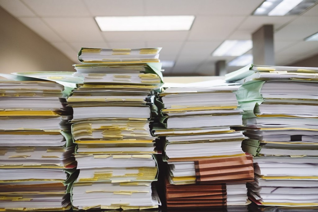 Pile of paper documents and folders