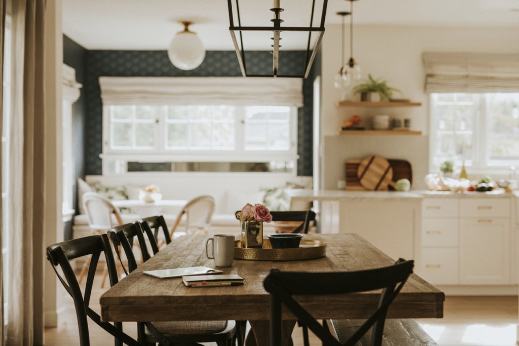 dining room area featuring glasses and wooden table