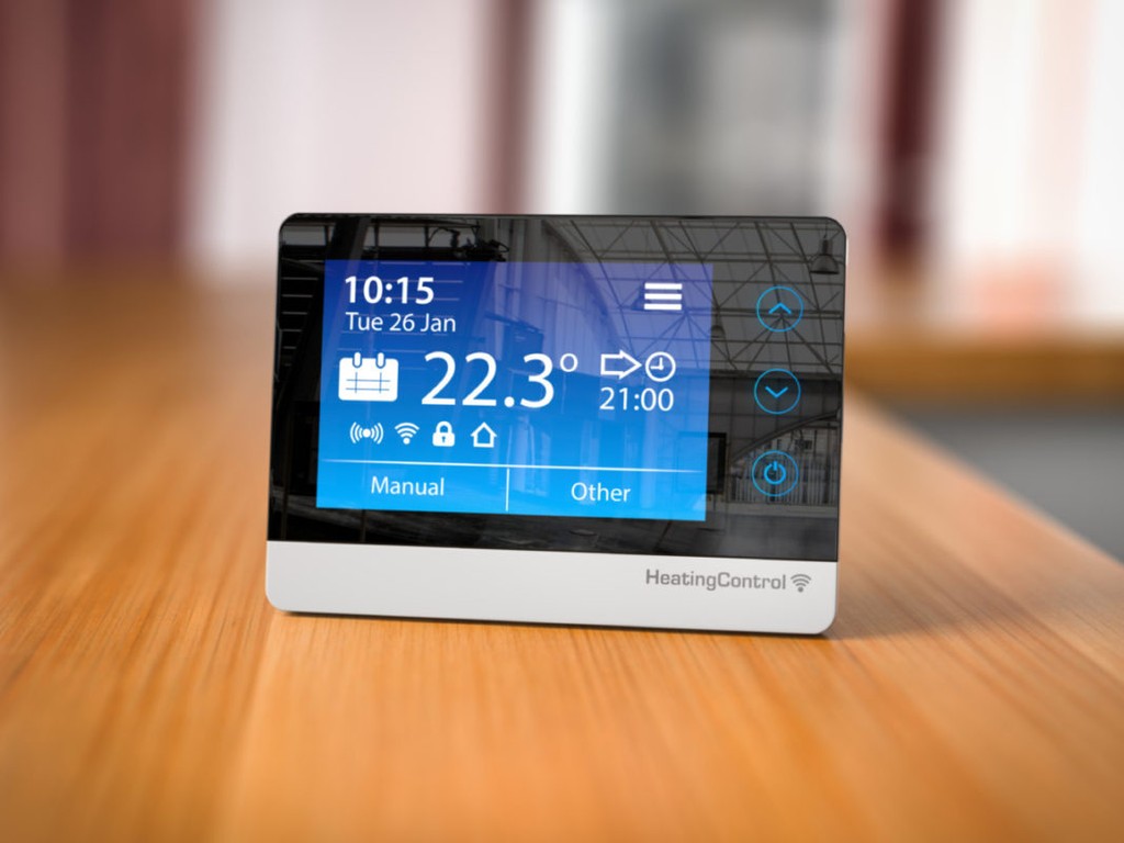 Heating climat control in home concept. Programmable thermostat on the table in room. 3d illustration