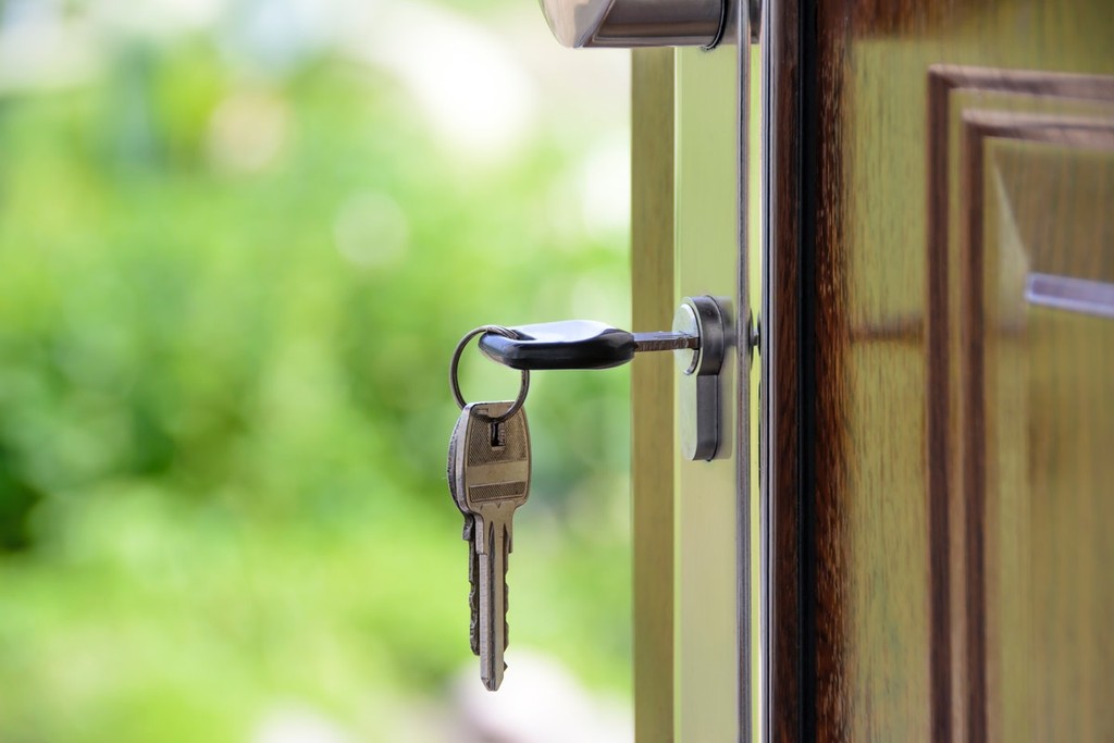 keys in the wooden door of a property