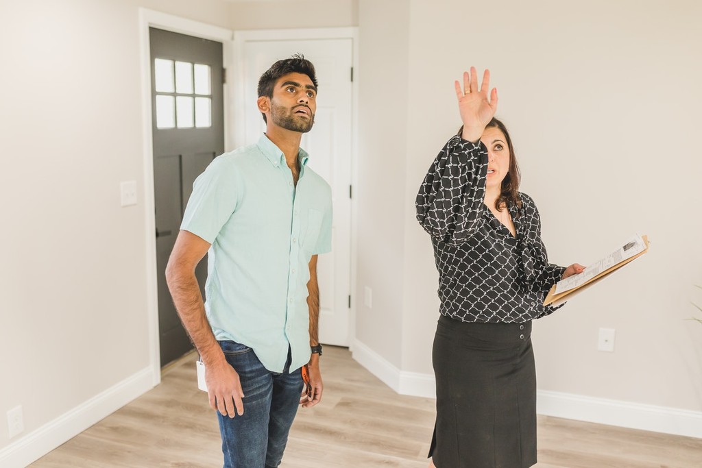 estate agent showing a man around a flat/apartment