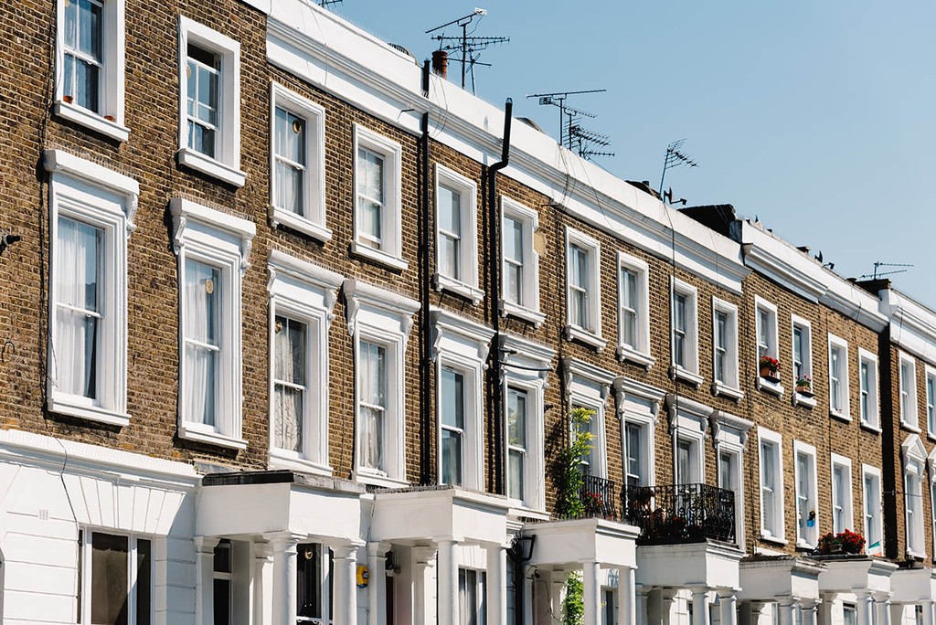 Townhouses with brick facade in Notting Hill, a district in West London in the Borough of Kensington and Chelsea