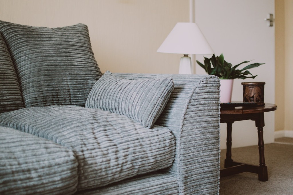 grey sofa in buy to let property