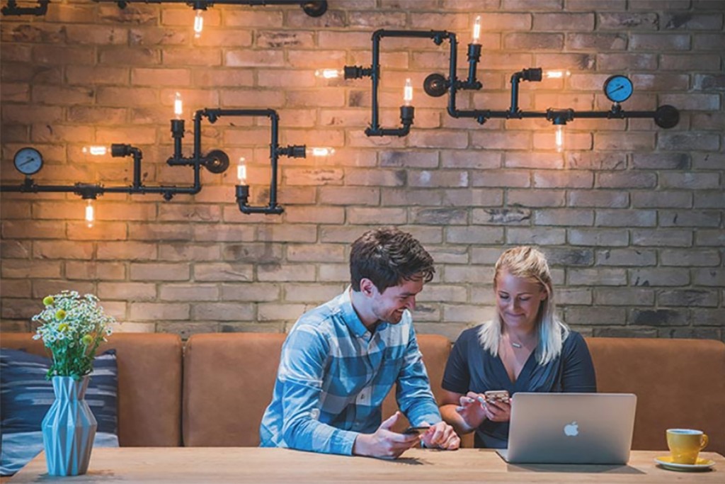 Couple Laughing in a build to rent cafe