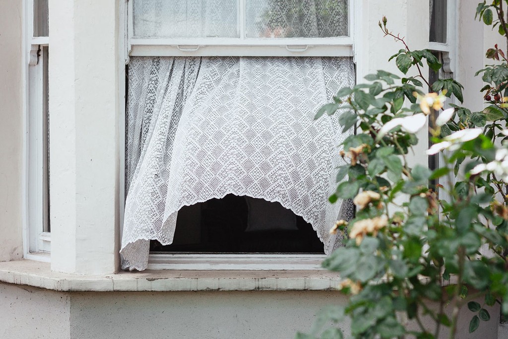 An open window of a house from outside, essential for house viewings during covid.