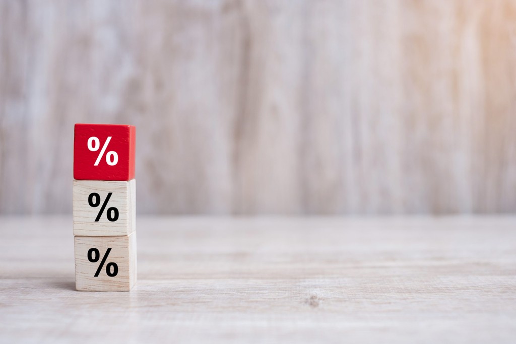 wood cube block with percentage symbol icon. Interest rate, financial, ranking and mortgage rates concept