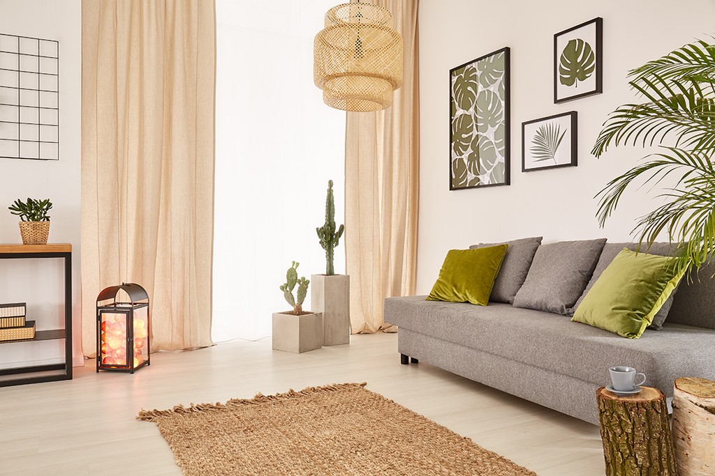 living room area with sofa and green pillows