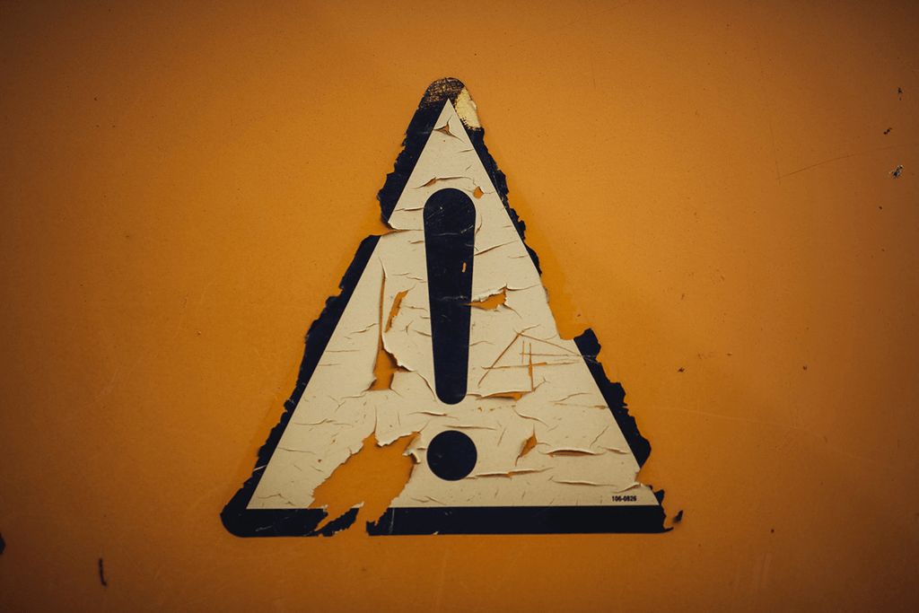 Warning sign set on a dark orange background