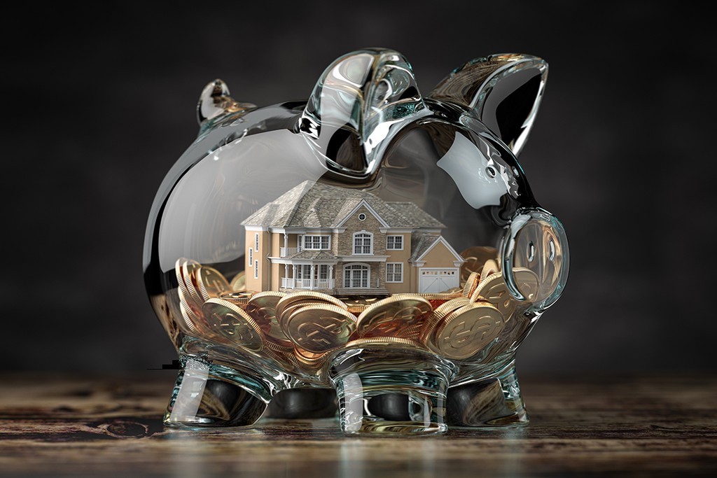 deposit savings in a glass piggybank