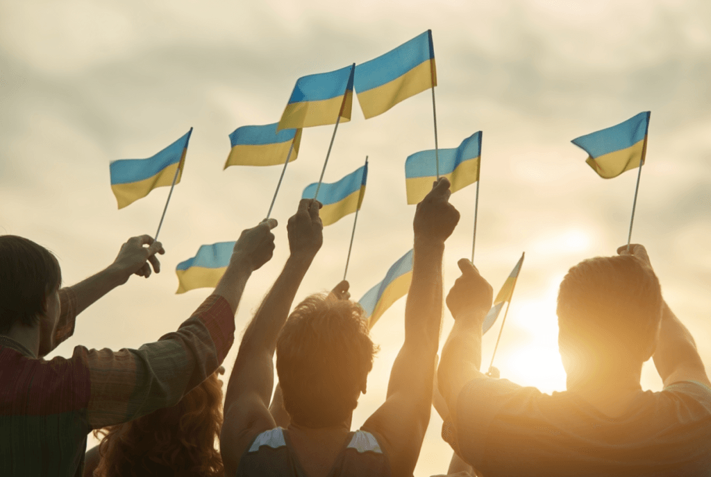 Ukrainian refugees wave flags